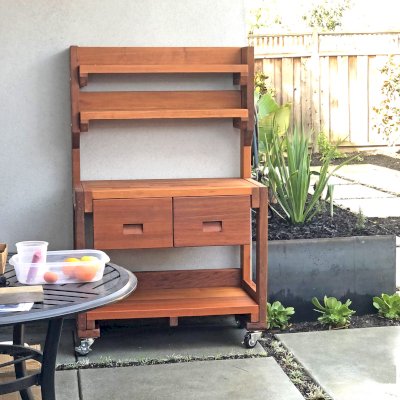 Eli's Redwood Potting Bench (Options: Standard Size, Mature Redwood, Casters, 2 Shelves, No Fold Down Sides, No Copper Inset, No Engraving, No Removable Lid, Transparent Premium Sealant). Photo Courtesy of B. Marinaro of Palo Alto, CA.